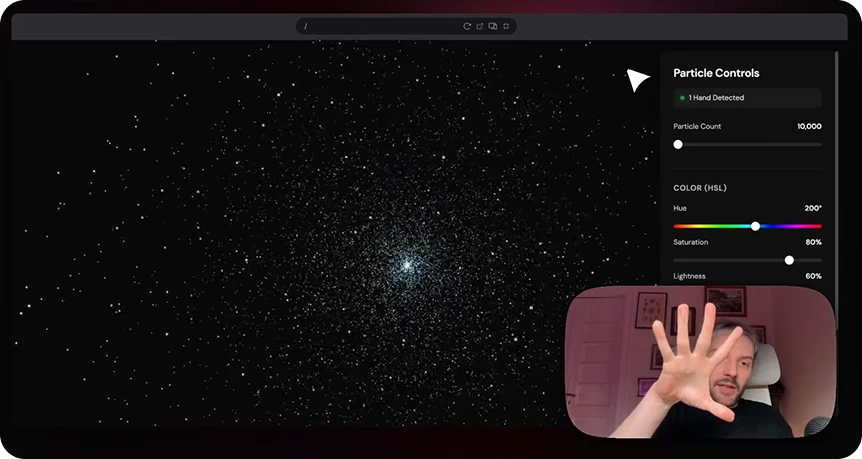 Bolt web app showing a particle simulation controlled by hand tracking gestures in a small video overlay.